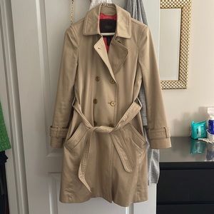 Coach trench coat in cream colour.